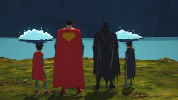 Movie still from “Batman and Superman: Battle of the Super Sons” (2022), directed by Matt Peters – A group of people standing next to each other in a field; Extreme Wide shot, Low angle