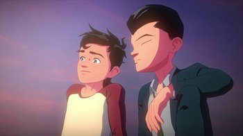 Movie still from “Batman and Superman: Battle of the Super Sons” (2022), directed by Matt Peters – Two men standing next to each other in front of a sky background; Medium shot, Low angle