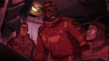 Movie still from “Batman: Death in the Family” (2020), directed by Brandon Vietti – A man in a red suit is standing next to another man in a red suit; Medium shot, High angle