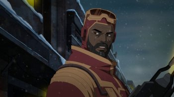 Movie still from “Batman: Death in the Family” (2020), directed by Brandon Vietti – A person with a beard and a helmet on; Close Up shot, Over the shoulder angle