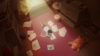 Movie still from “Batman: Death in the Family” (2020), directed by Brandon Vietti – A child laying on the ground with papers on the floor; Wide shot, High angle