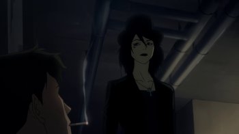 Movie still from “Batman: Death in the Family” (2020), directed by Brandon Vietti – A woman standing next to another woman in a dark room; Close Up shot, Over the shoulder angle