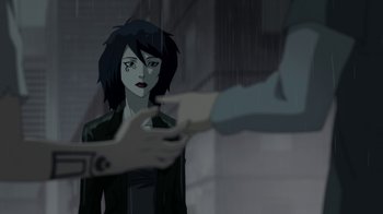 Movie still from “Batman: Death in the Family” (2020), directed by Brandon Vietti – An animated woman in a black jacket is looking at a man; Medium shot, Over the shoulder angle