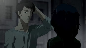 Movie still from “Batman: Death in the Family” (2020), directed by Brandon Vietti – A young man standing in front of another man; Close Up shot, Over the shoulder angle