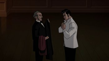 Movie still from “Batman: Gotham by Gaslight” (2018), directed by Sam Liu – Two men standing next to each other in a dark room; Medium shot, Over the shoulder angle