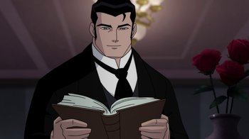 Movie still from “Batman: Gotham by Gaslight” (2018), directed by Sam Liu – A man in a suit and tie holding an open book; Medium shot, Over the shoulder angle