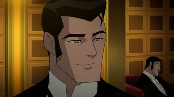 Movie still from “Batman: Gotham by Gaslight” (2018), directed by Sam Liu – A man in a suit and tie is looking at the camera; Close Up shot, Over the shoulder angle