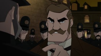 Movie still from “Batman: Gotham by Gaslight” (2018), directed by Sam Liu – A man with a mustache is in front of a group of men; Close Up shot, Over the shoulder angle