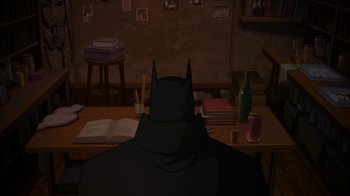 Movie still from “Batman: Gotham by Gaslight” (2018), directed by Sam Liu – A cartoon picture of a batman sitting at a table; Wide shot, High angle