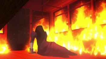 Movie still from “Batman: Gotham by Gaslight” (2018), directed by Sam Liu – A person laying on the ground in front of a fire; Wide shot, Low angle