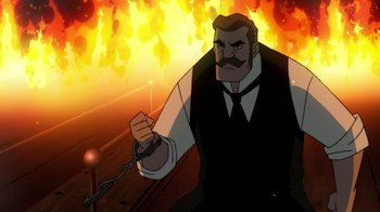 Movie still from “Batman: Gotham by Gaslight” (2018), directed by Sam Liu – An animated picture of a man chained to a chain; Medium shot, Over the shoulder angle