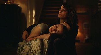 Movie still from “Euphoria” (2019), created by Sam Levinson – A woman and a girl are sleeping on a couch; Medium shot, Low angle
