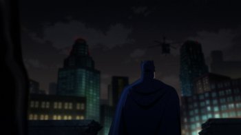 Movie still from “Batman: Hush” (2019), directed by Justin Copeland – A man standing in front of a city skyline at night; Extreme Wide shot, Low angle