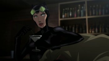 Movie still from “Batman: Hush” (2019), directed by Justin Copeland – A woman is holding a drink in her hand; Medium shot, High angle