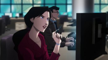 Movie still from “Batman: Hush” (2019), directed by Justin Copeland – A woman sitting in front of a computer screen; Medium shot, Over the shoulder angle