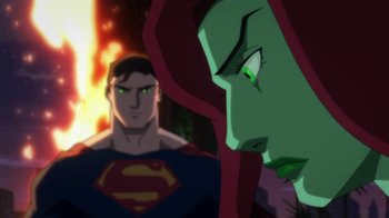 Movie still from “Batman: Hush” (2019), directed by Justin Copeland – A man and a woman in a green and blue superman costume; Medium shot, Over the shoulder angle