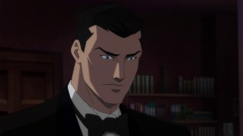 Movie still from “Batman: Hush” (2019), directed by Justin Copeland – A person wearing a suit and bow tie; Close Up shot, Over the shoulder angle