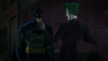 Movie still from “Batman: Hush” (2019), directed by Justin Copeland – A batman and the riddler talking to one another; Medium shot, Over the shoulder angle