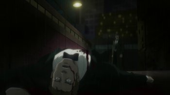 Movie still from “Batman: Hush” (2019), directed by Justin Copeland – A man with a bow tie laying on the ground in front of another man; Wide shot, High angle