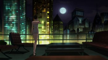 Movie still from “Batman: Hush” (2019), directed by Justin Copeland – A woman standing on a balcony in front of a large city at night; Extreme Wide shot, Low angle