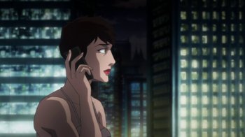 Movie still from “Batman: Hush” (2019), directed by Justin Copeland – A woman talking on a cell phone in front of some buildings; Medium shot, Over the shoulder angle