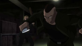 Movie still from “Batman: Hush” (2019), directed by Justin Copeland – Two men are fighting in a dark room; Medium shot, Over the shoulder angle