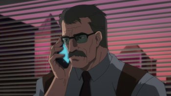 Movie still from “Batman: Hush” (2019), directed by Justin Copeland – An older man with glasses talking on a cell phone; Close Up shot, Low angle