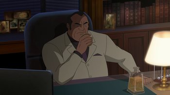 Movie still from “Batman: The Killing Joke” (2016), directed by Sam Liu – An animated man sitting at a desk with his hand under his chin; Medium shot, Over the shoulder angle