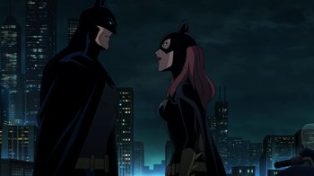 Movie still from “Batman: The Killing Joke” (2016), directed by Sam Liu – A couple of people standing next to each other in front of a city; Medium shot, Over the shoulder angle