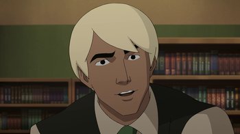 Movie still from “Batman: The Killing Joke” (2016), directed by Sam Liu – A man with blonde hair and a green neck tie; Close Up shot, High angle