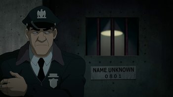 Movie still from “Batman: The Killing Joke” (2016), directed by Sam Liu – An animated picture of a man in a jail cell; Medium shot, High angle