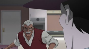 Movie still from “Batman: The Killing Joke” (2016), directed by Sam Liu – An old man is standing in front of an older man; Medium shot, Over the shoulder angle