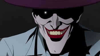 Movie still from “Batman: The Killing Joke” (2016), directed by Sam Liu – A smiling joker wearing a purple hat; Close Up shot, Low angle