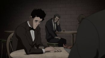 Movie still from “Batman: The Killing Joke” (2016), directed by Sam Liu – A group of men sitting around a table; Medium shot, Over the shoulder angle