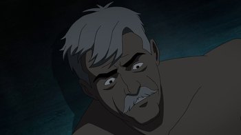Movie still from “Batman: The Killing Joke” (2016), directed by Sam Liu – An old man with a gray beard is looking at the camera; Close Up shot, High angle
