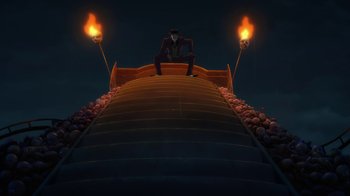 Movie still from “Batman: The Killing Joke” (2016), directed by Sam Liu – A man sitting on top of a set of stairs at night; Extreme Wide shot, Low angle