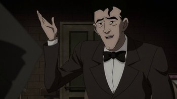 Movie still from “Batman: The Killing Joke” (2016), directed by Sam Liu – A man wearing a suit and bow tie; Medium shot, Over the shoulder angle