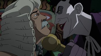 Movie still from “Batman: The Killing Joke” (2016), directed by Sam Liu – Two cartoon characters face each other in an animated scene; Close Up shot, Over the shoulder angle