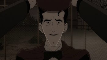 Movie still from “Batman: The Killing Joke” (2016), directed by Sam Liu – A man with a bow tie is looking at the camera; Close Up shot, High angle
