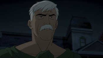 Movie still from “Batman: The Killing Joke” (2016), directed by Sam Liu – An old man with a white beard and mustache; Close Up shot, Over the shoulder angle