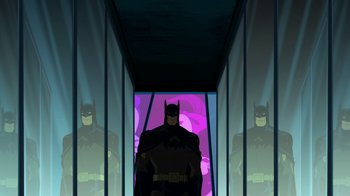 Movie still from “Batman: The Killing Joke” (2016), directed by Sam Liu – A batman character standing in front of a mirror; Wide shot, Low angle