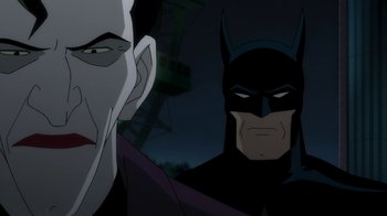 Movie still from “Batman: The Killing Joke” (2016), directed by Sam Liu – Two people in a batman animated series; Close Up shot, Over the shoulder angle