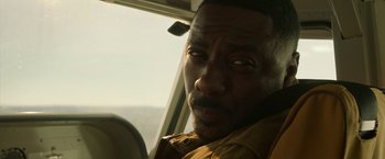 Movie still from “Beast” (2022), directed by Baltasar Kormákur – A person in a car; Close Up shot, Low angle