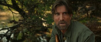 Movie still from “Beast” (2022), directed by Baltasar Kormákur – A person with a beard; Close Up shot, Over the shoulder angle