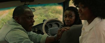 Movie still from “Beast” (2022), directed by Baltasar Kormákur – A man and a woman in a car; Close Up shot, Over the shoulder angle