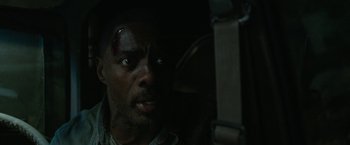 Movie still from “Beast” (2022), directed by Baltasar Kormákur – A person with a face covered in blood; Close Up shot, High angle