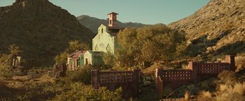 Movie still from “Beast” (2022), directed by Baltasar Kormákur – An old building in the middle of the desert; Extreme Wide shot, Low angle