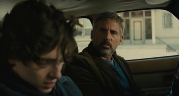 Movie still from “Beautiful Boy” (2018), directed by Felix van Groeningen – A man sitting in the back of a car next to a boy; Close Up shot, Over the shoulder angle