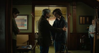 Movie still from “Beautiful Boy” (2018), directed by Felix van Groeningen – Two men are standing in a room and one is holding his hands up to the other; Medium shot, Over the shoulder angle