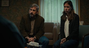 Movie still from “Beautiful Boy” (2018), directed by Felix van Groeningen – A man and a woman sitting next to each other in a room; Medium shot, Over the shoulder angle